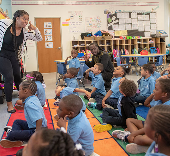 teacher in classroom teaching young students