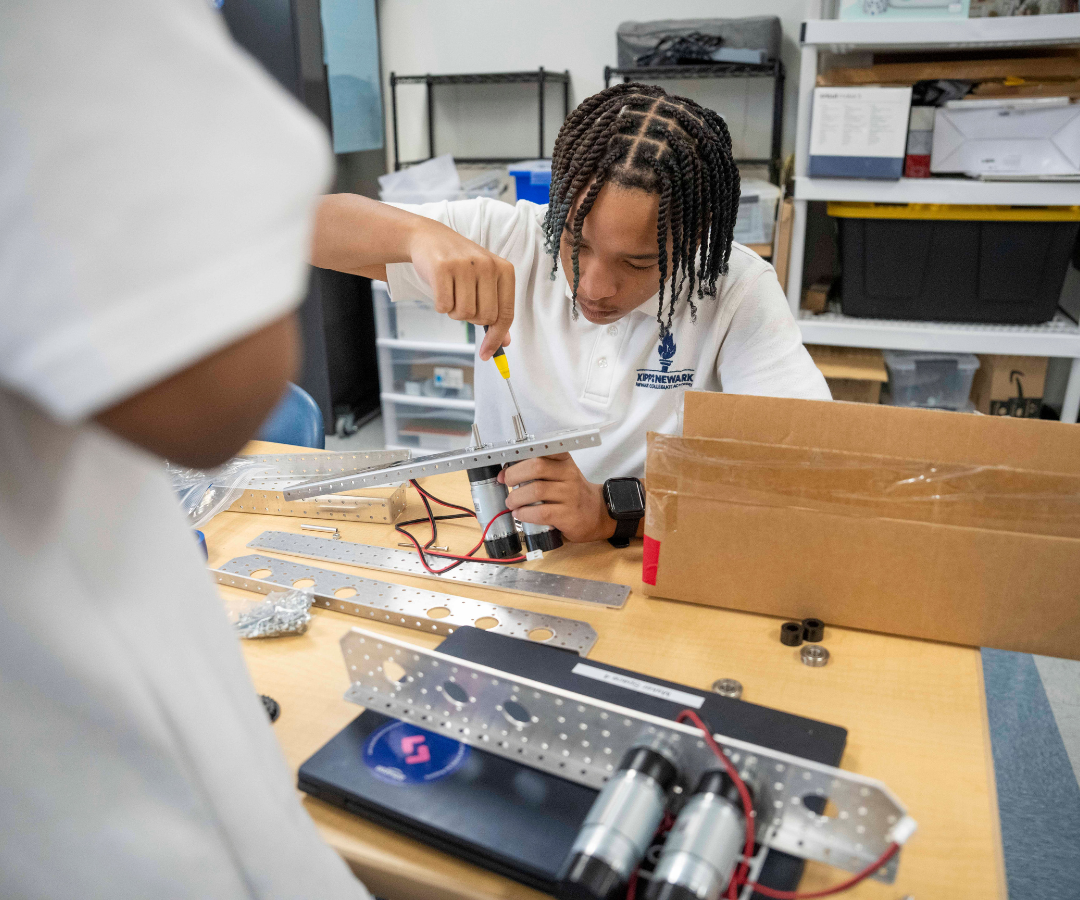 male student in robotics classroom