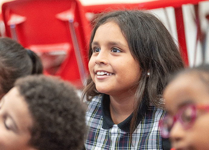 student smiling in classroom